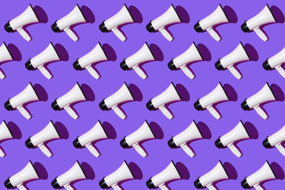 White megaphones pattern with black ornament on purple background. Shout, message, announcement and news concept.