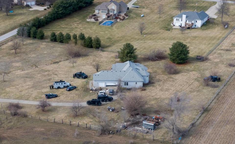 Tactical police vehicles remain outside of the house at 1111 N. Else Smith Road where a suspect opened fire on police and a civil process server on Thursday, Feb. 29, 2024, in Independence.