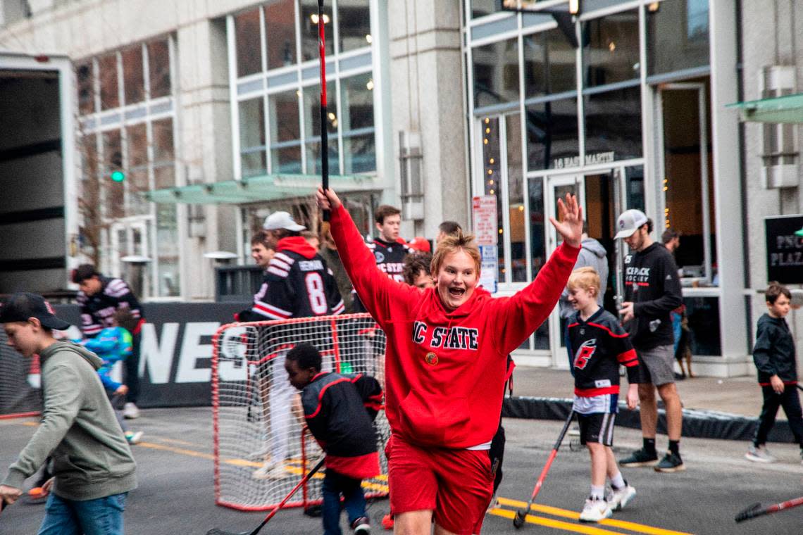 Children play street hockey with members of the N.C. State ice hockey team during the Carolina Hurricanes Fan Fest 2023, a free, all-day party on Fayetteville Street in downtown Raleigh Friday, Feb. 17, 2023.