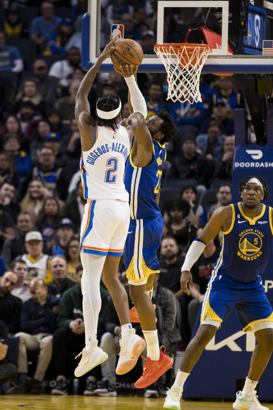 Oklahoma City Thunder guard Shai Gilgeous-Alexander (2) shoots over Golden State Warriors forward Andrew Wiggins, obscured, during the first half of an NBA basketball game in San Francisco, Monday, Feb. 6, 2023. (AP Photo/John Hefti)