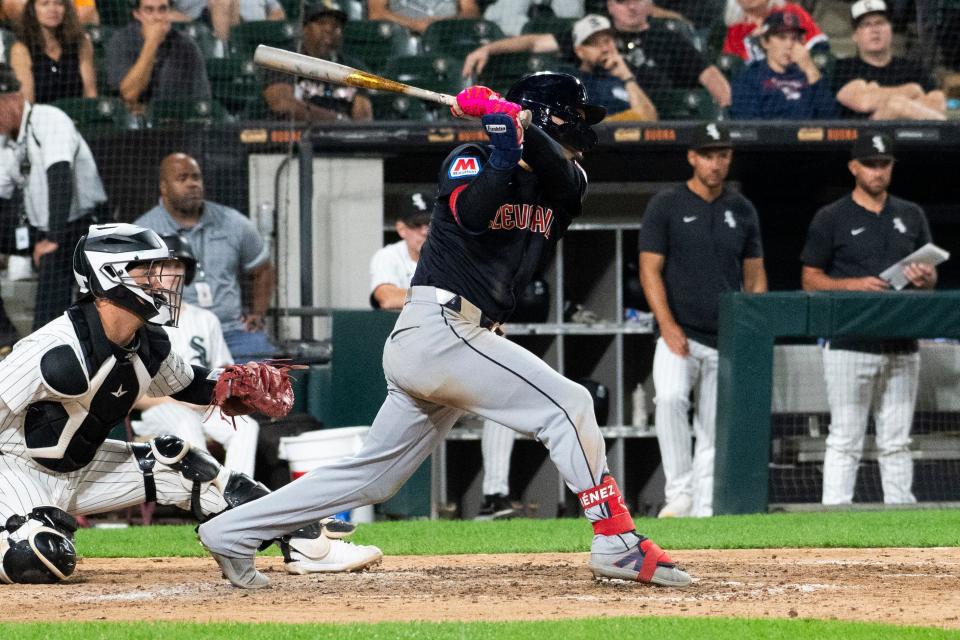 Guardians second baseman Andres Gimenez hits a RBI single against the White Sox during the ninth inning, Sept. 10, 2024, in Chicago.