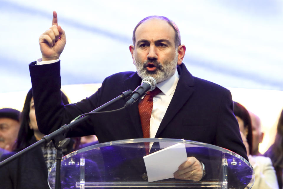 Armenian Prime Minister Nikol Pashinyan addresses his supporters during a rally in his support in the center of Yerevan, Armenia, Monday, March 1, 2021. Amid escalating political tensions in Armenia, supporters of the country's embattled prime minister and the opposition are staging massive rival rallies in the capital of Yerevan. Prime Minister Nikol Pashinyan has faced opposition demands to resign since he signed a peace deal in November that ended six weeks of intense fighting with Azerbaijan over the Nagorno-Karabakh region. (Hayk Baghdasaryan/PHOTOLURE via AP)