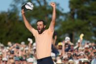 Scottie Scheffler celebrates his win at the Masters golf tournament at Augusta National Golf Club Sunday, April 14, 2024, in Augusta, Ga. (AP Photo/Ashley Landis)