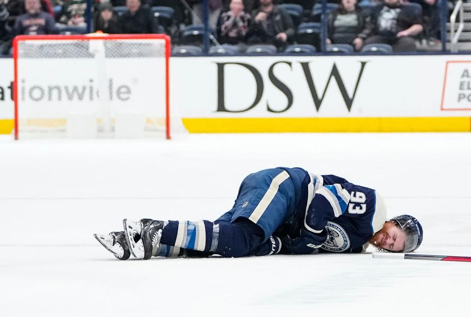 Columbus Blue Jackets right wing Jakub Voracek (93) falls to the ice after a collision during the third period of the NHL hockey game against the Minnesota Wild at Nationwide Arena in Columbus on March 11, 2022. The Blue Jackets won 3-2 in a shootout.