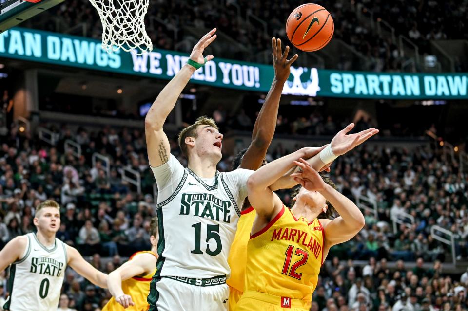 Michigan State's Carson Cooper, left, and Maryland's Jamie Kaiser, Jr. go after a rebound during the first half on Saturday, Feb. 3, 2024, at the Breslin Center in East Lansing.