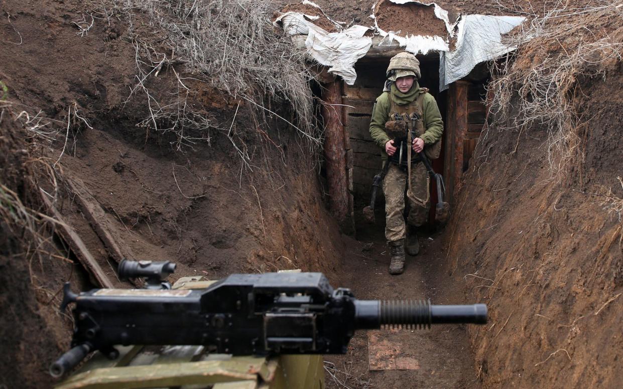 A Ukrainian soldier pictured on the frontline against Russian separatists in the Lugansk region earlier this month. There are growing fears that Russia could attempt to annex more territory belonging to Kiev - GETTY IMAGES