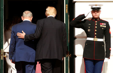 U.S. President Donald Trump (R) escorts Israeli Prime Minister Benjamin Netanyahu into the White House in Washington, U.S., February 15, 2017.REUTERS/Kevin Lamarque