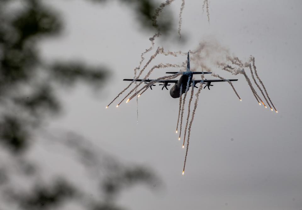 A Kentucky National Guard C-130J drops flares over the Ohio River during Thunder Over Louisville on Saturday, April 20, 2024.