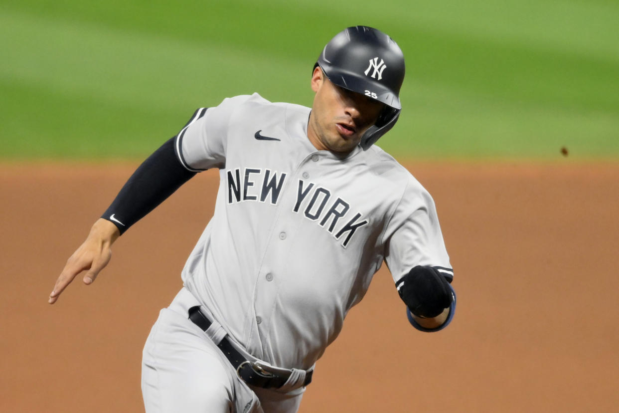 Sep 29, 2020; Cleveland, Ohio, USA; New York Yankees shortstop Gleyber Torres (25) rounds third base while scoring against the Cleveland Indians in the fourth inning at Progressive Field. Mandatory Credit: David Richard-USA TODAY Sports