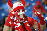<p>Swiss Miss: A female Switzerland fan decked out all in red. (Getty) </p>