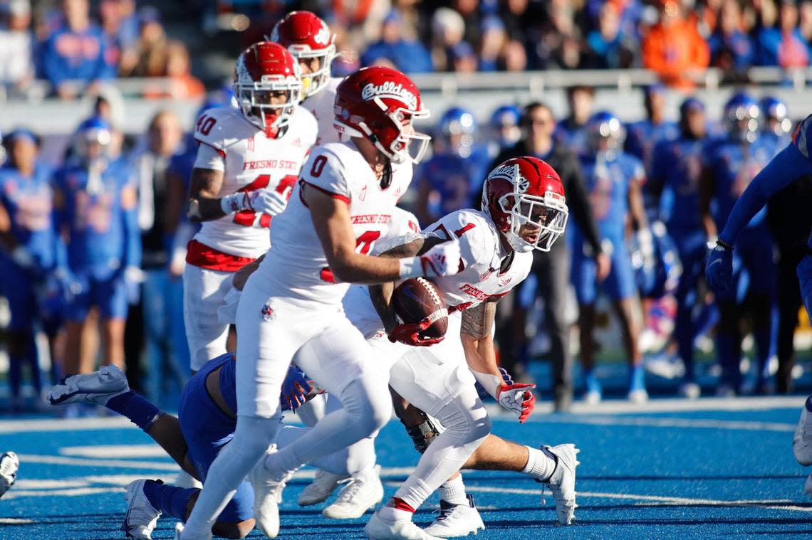 Fresno State wide receiver Nikko Remigio (1) returns the kickoff against Boise State during the first half of an NCAA college football game for the Mountain West championship, Saturday, Dec. 3, 2022, in Boise, Idaho. (AP Photo/Otto Kitsinger)