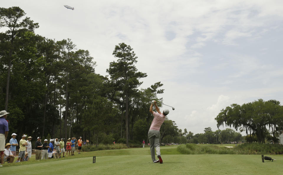 Justin Rose of England, hits from the ninth tee during the final round of The Players championship golf tournament at TPC Sawgrass, Sunday, May 11, 2014 in Ponte Vedra Beach, Fla. (AP Photo/Gerald Herbert)