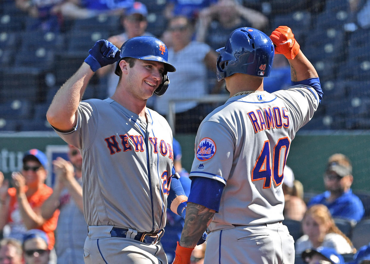 Aug 18, 2019; Kansas City, MO, USA; New York Mets first baseman Pete Alonso (20) celebrates with designated hitter Wilson Ramos (40) after hitting a solo home run during the ninth inning against the Kansas City Royals at Kauffman Stadium. Mandatory Credit: Peter G. Aiken/USA TODAY Sports