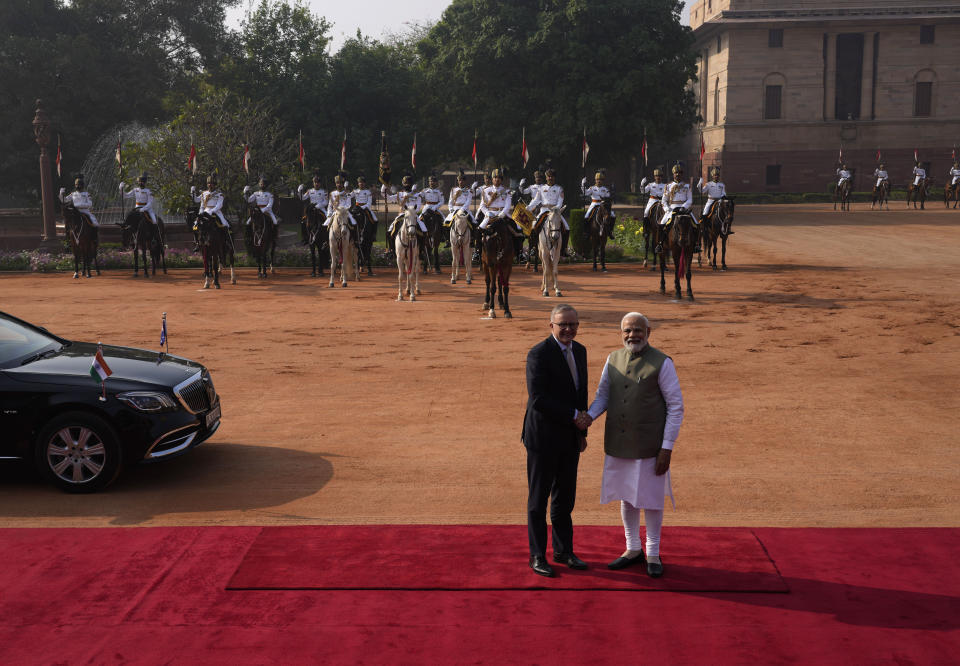 Indian Prime Minister Narendra Modi welcomes his Australian counterpart Anthony Albanese during laters's ceremonial reception at the Indian presidential palace, in New Delhi, India, Friday, March 10, 2023. Australia is striving to strengthen security cooperation with India and also deepen economic and cultural ties, Prime Minister Anthony Albanese said on Friday. (AP Photo/Manish Swarup)