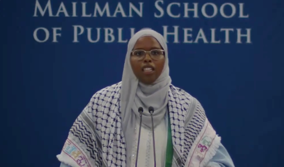 Saham David Ahmed Ali, pictured speaking at the Columbia University Mailman School of Public Health graduation ceremony, had her microphone cut out twice during her speech (Columbia University)