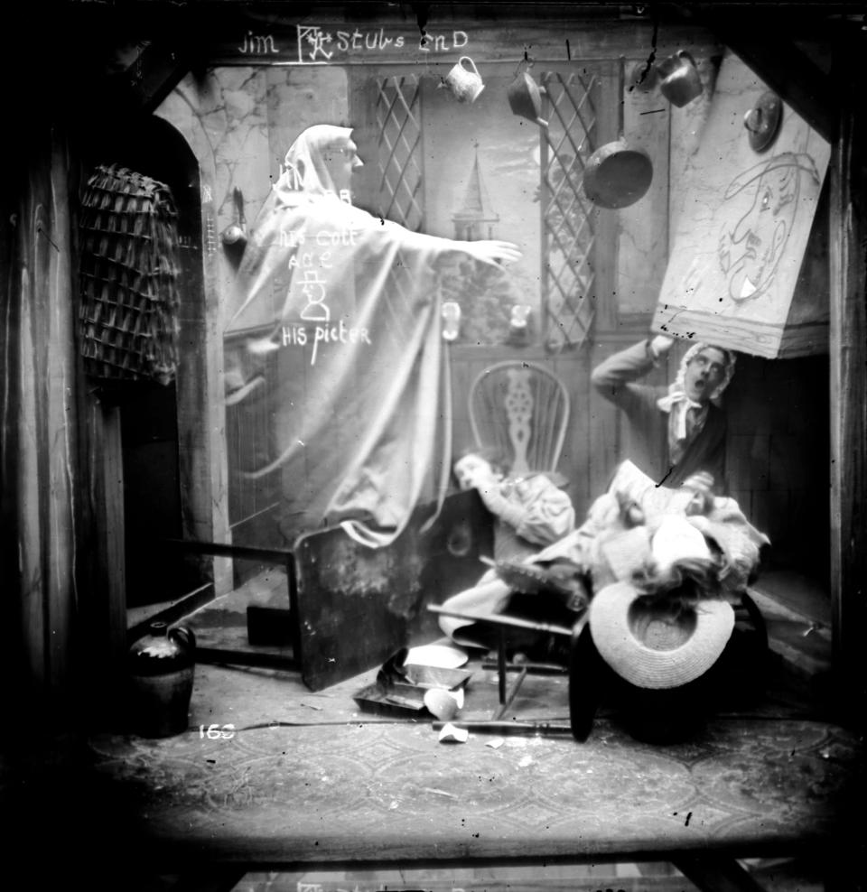 circa 1865: A ghost floating slowly towards a dishevelled man hiding in a corner. London Stereoscopic Company Comic Series - 169 (Photo by London Stereoscopic Company/Getty Images)