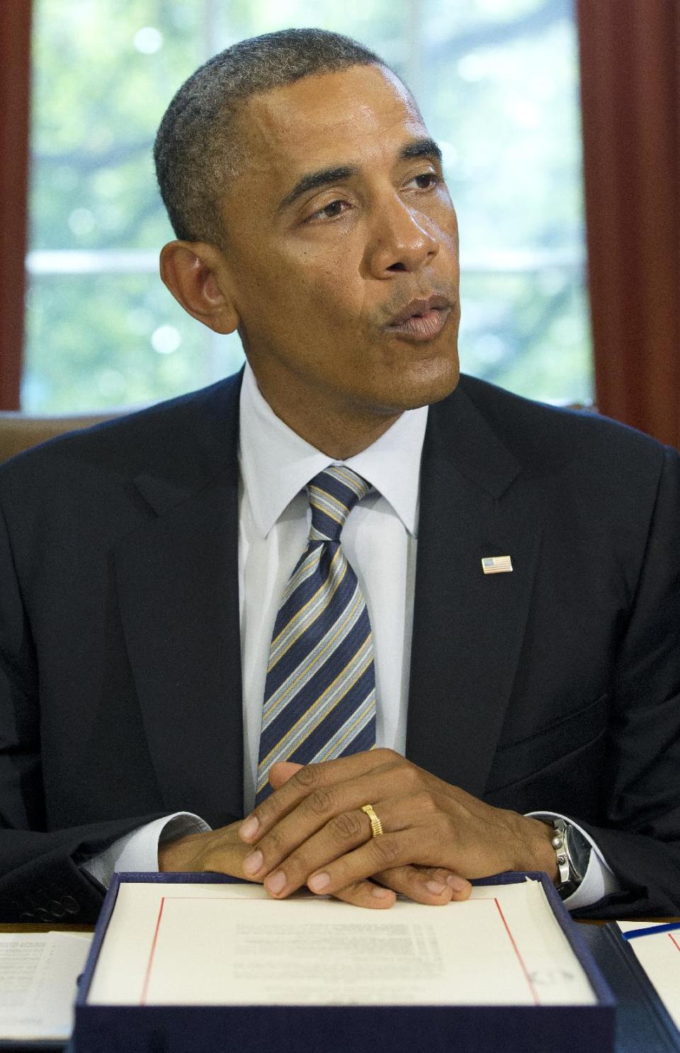 President Barack Obama speaks in the Oval Office at the White House in Washington, Monday, Aug. 6, 2012, before signing the Honoring America’s Veterans and Caring for Camp Lejeune Families Act of 2012. (AP Photo/Haraz N. Ghanbari)