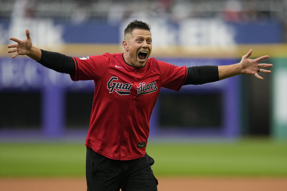 Professional wrestler Michael Gregory "The Miz" Mizanin reacts after throwing out a ceremonial first pitch before a baseball game between the Detroit Tigers and the Cleveland Guardians, Tuesday, May 7, 2024, in Cleveland. (AP Photo/Sue Ogrocki)