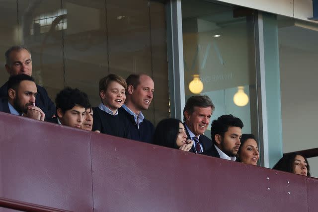 <p>Catherine Ivill/Getty</p> Prince William and Prince George watch Aston Villa