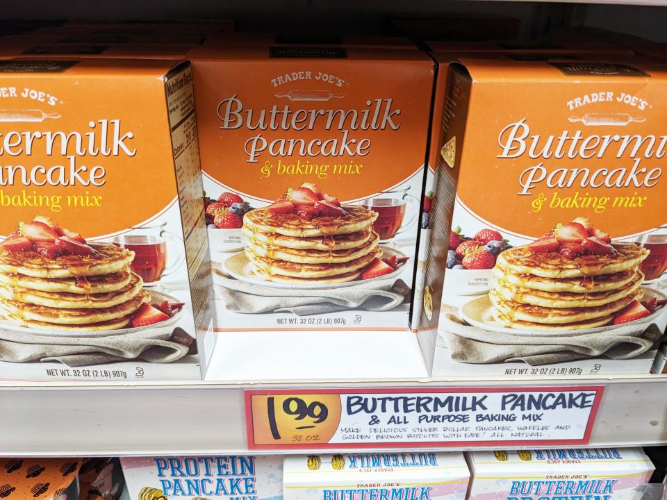 Boxes of buttermilk pancake mix on the shelf at Trader Joe's.