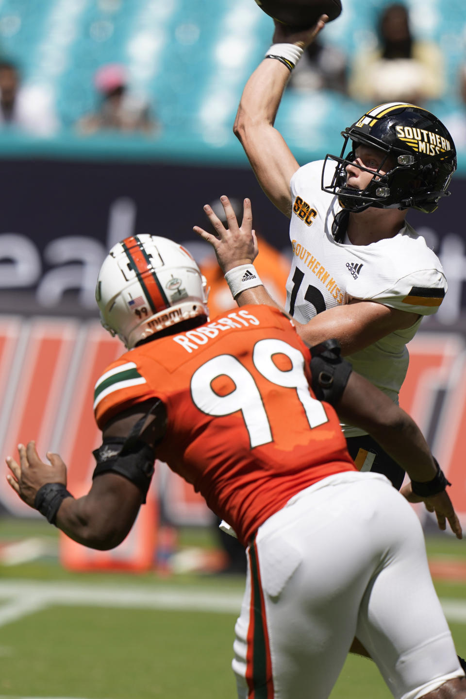 Miami defensive lineman Elijah Roberts (99) rushes Southern Miss quarterback Zach Wilcke during the second half of an NCAA college football game, Saturday, Sept. 10, 2022, in Miami Gardens, Fla. (AP Photo/Wilfredo Lee)