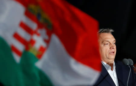 Hungarian Prime Minister Viktor Orban addresses the supporters after the announcement of the partial results of parliamentary election in Budapest, Hungary, April 8, 2018.REUTERS/Leonhard Foeger