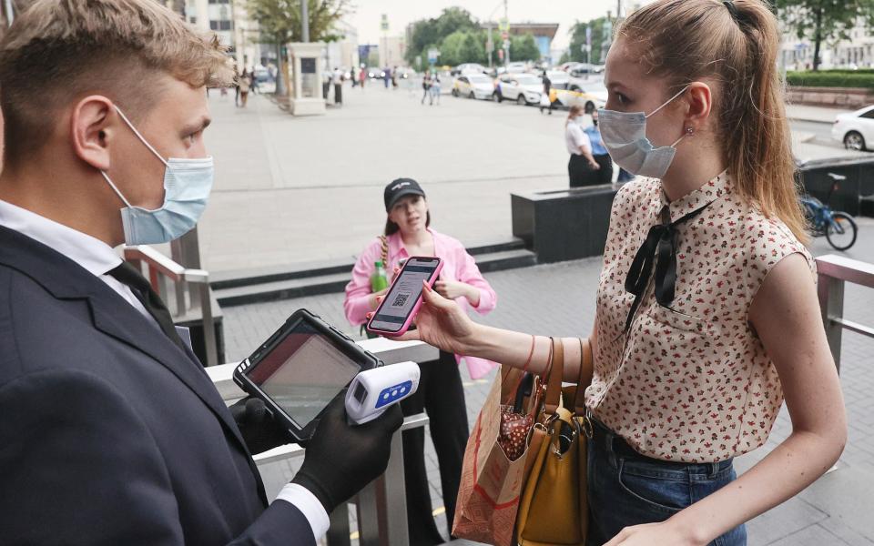 A customer's QR-code Covid passport is scanned at a McDonald's outlet in central Moscow, Russia - Sergei Bobylev\\TASS via Getty Images
