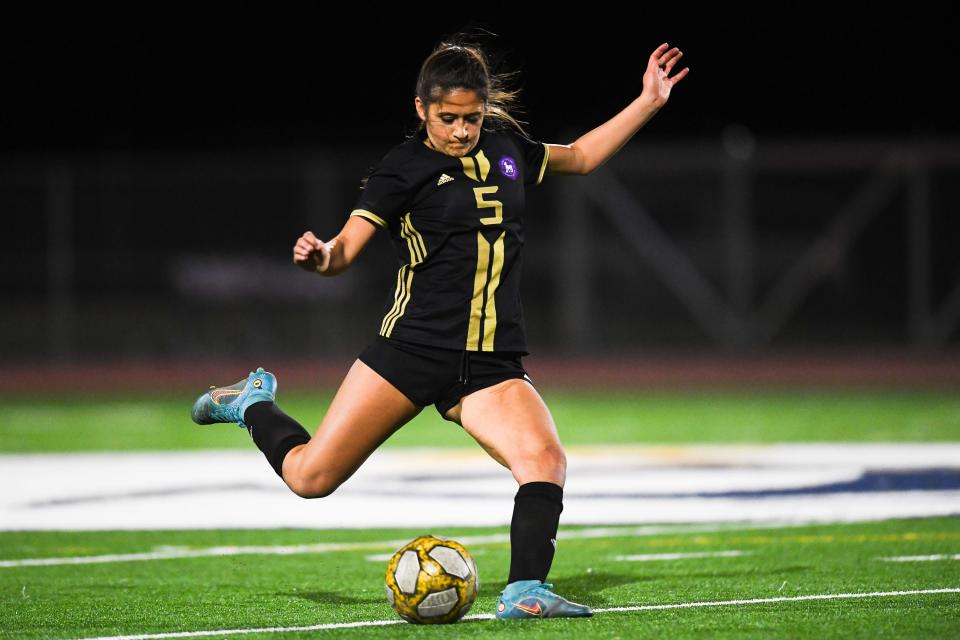 Fort Collins girls soccer player Fiona Khankhanian (5) steps into a kick during a high school match against Rocky Mountain at PSD Stadium in Timnath on April 13, 2023.