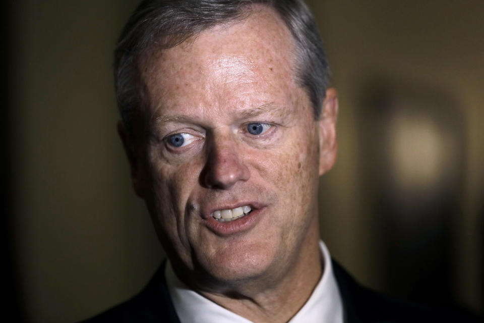 FILE - In this Monday, Sept. 16, 2019 file photo Massachusetts Gov. Charlie Baker speaks with reporters at the Statehouse, in Boston. Baker is declaring a public health emergency and ordering a four-month temporary ban on all vaping products in the state. The Republican governor made the announcement Tuesday, Sept. 24, amid growing concern about the health effects of vaping products. The ban must be approved by a health council that is nearly certain to do so. (AP Photo/Steven Senne, File)