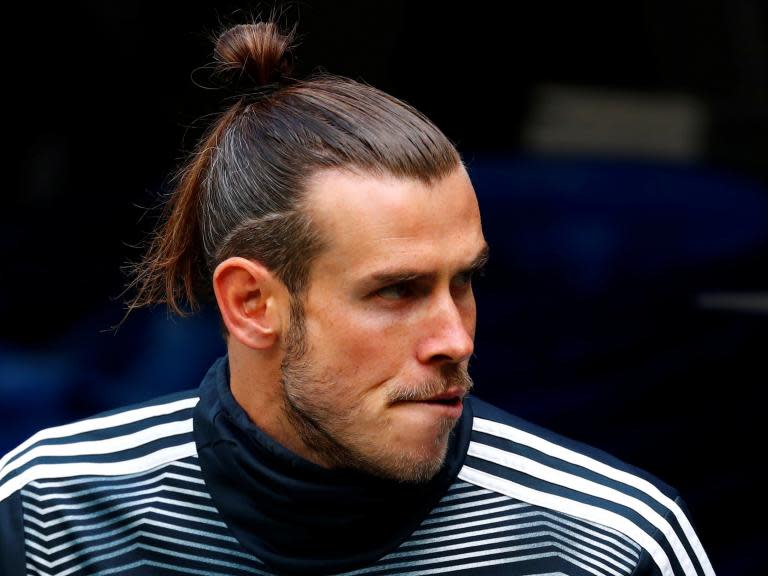 Ryan Giggs has dismissed claims that Gareth Bale has fallen out of love with football and insists the Real Madrid star’s enthusiasm for the game is as strong as ever.Wales forward Bale endured a torrid end to the season, as Real manager Zinedine Zidane dropped him from his starting XI and even refused to bring him off the bench in the final league game.Bale has become a regular target for Real fans, who have accused the 29-year-old of being more interested in playing his self-confessed passion of golf than football.But Bale remains Wales’ talisman heading into Euro 2020 qualifiers against Croatia and Hungary, and Giggs said: “I saw him this week (at a Portugal training camp) and he looked like he enjoyed football to me.“He was sharp, he wanted the ball, and he was practising his trademark of cutting in on his left foot. He scored a great goal.“Afterwards when a lot of the lads went in he was practising his shooting, so that doesn’t strike me as someone who just wants to get off and go back to his room.“It struck me as a professional who still loves football.”Bale joined Real from Tottenham in 2013 for what was then a world-record fee of £85.3million.He has since won four Champions League titles, scoring decisive goals in two of those finals against Atletico Madrid and Liverpool, as well as three FIFA World Club titles, a LaLiga crown and a Copa del Rey title.But the future of Bale, who has scored over 100 goals for Real and is contracted there until 2022, remains uncertain, with the Spanish giants reportedly keen to get him off the wage bill this summer.Bale managed only 14 goals this season, has not scored since the middle of March and a recent poll of almost five million Real fans indicated only nine per cent wanted him to stay at the Bernabeu.Asked if he was surprised by the criticism aimed at Bale in Madrid, Giggs said: “Yes, but I’m not over there.“I’m not a Real Madrid fan. I don’t know the ins and outs and I’m only looking from the outside.“But you’ve got a player who won the team the Champions League final last year with one of the best goals you’ve ever seen and performs for that team week in, week out.“I remember the original Ronaldo getting stick off Real Madrid fans. I remember Cristiano (Ronaldo) getting stick early doors.“It’s that kind of club, it’s a club like no other where the white handkerchiefs come out if they don’t like you. That’s just the way it is.”Bale has completed 90 minutes only twice since Wales started their Euro 2020 qualifying campaign with a 1-0 home victory over Slovakia on March 24.And Bale’s fitness will be tested in the double-header with Croatia and Hungary, the two games coming in the space of three days and expected to be played in hot conditions.“If he’s flying for Real Madrid then I’m asked if that’s a benefit,” Giggs said.“If he’s not, then he’s coming in fresh. There is always an angle. We played a game (on Tuesday) and he looked really good, sharp and really fresh.“I’m excited to see him in these two games.”