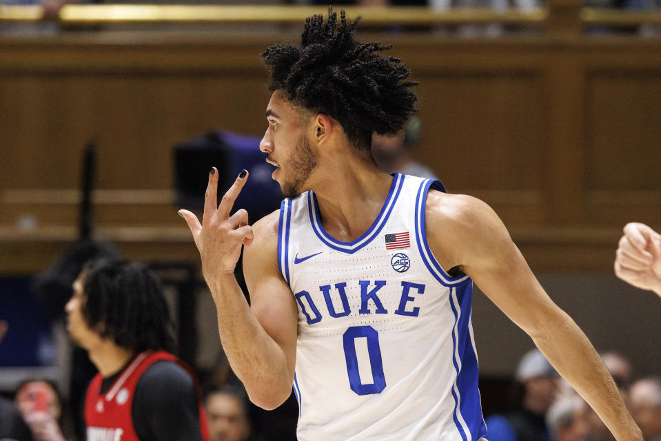 Duke's Jared McCain (0) reacts after hitting a 3-point shot against Louisville during the first half of an NCAA college basketball game in Durham, N.C., Wednesday, Feb. 28, 2024. (AP Photo/Ben McKeown)