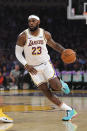 Los Angeles Lakers forward LeBron James dribbles during the first half of the team's preseason NBA basketball game against the Golden State Warriors on Wednesday, Oct. 16, 2019, in Los Angeles. (AP Photo/Mark J. Terrill)