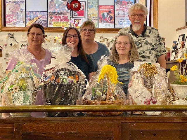 Sebring Ohio Historical Society members and volunteers, from left, Nancy Whinnery, Beth Howell, Christy Thayer, Michal Barrett and Frank Barrett, stand with some of the raffle baskets that will be available for bid at the upcoming Spring Fling 2023.