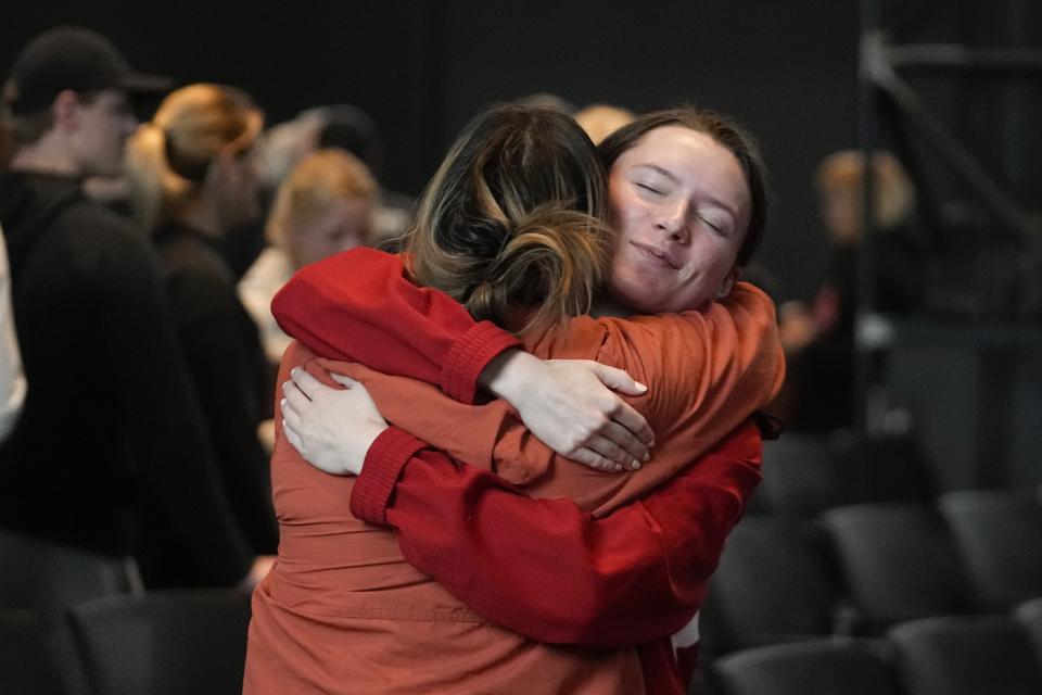 Attendees comfort each other following a prayer service for Buffalo Bills' Damar Hamlin at Crossroads Uptown Church, Tuesday, Jan. 3, 2023, in Cincinnati. Hamlin was taken to the hospital after collapsing on the field during an NFL football game against the Cincinnati Bengals on Monday night.(AP Photo/Darron Cummings)