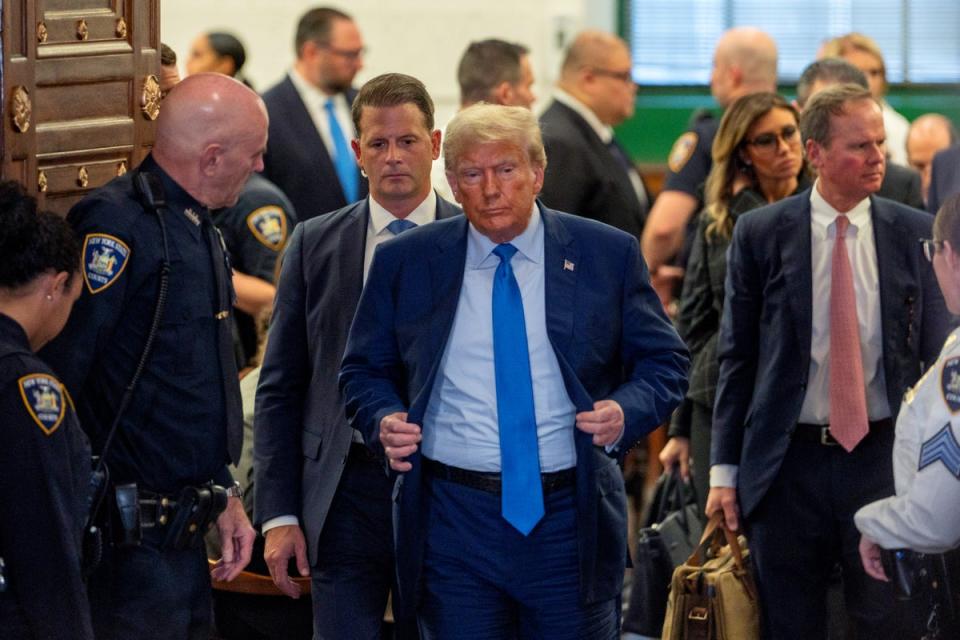 Donald Trump leaves Judge Arthur Engoron’s courtroom on 6 November after testifiting in a civil fraud trial targeting his real estate business (Getty Images)