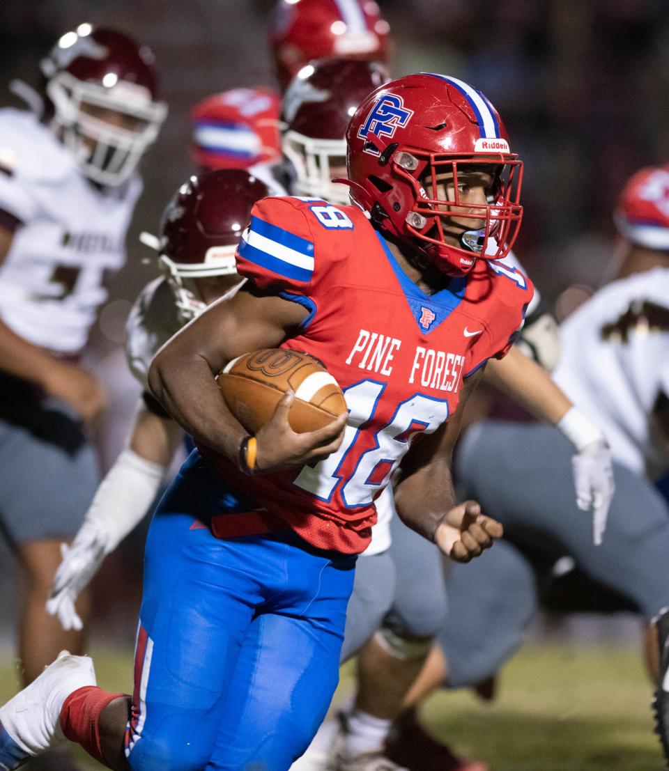 Miequle Brock (18) carries the ball during the Niceville vs Pine Forest football game at Pine Forest High School in Pensacola on Friday, Oct. 7, 2022.