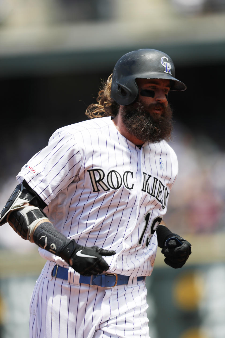 Colorado Rockies' Charlie Blackmon circles the bases after hitting a solo home run off San Diego Padres starting pitcher Nick Margevicius to lead off the bottom of the first inning of a baseball game Sunday, June 16, 2019, in Denver. (AP Photo/David Zalubowski)
