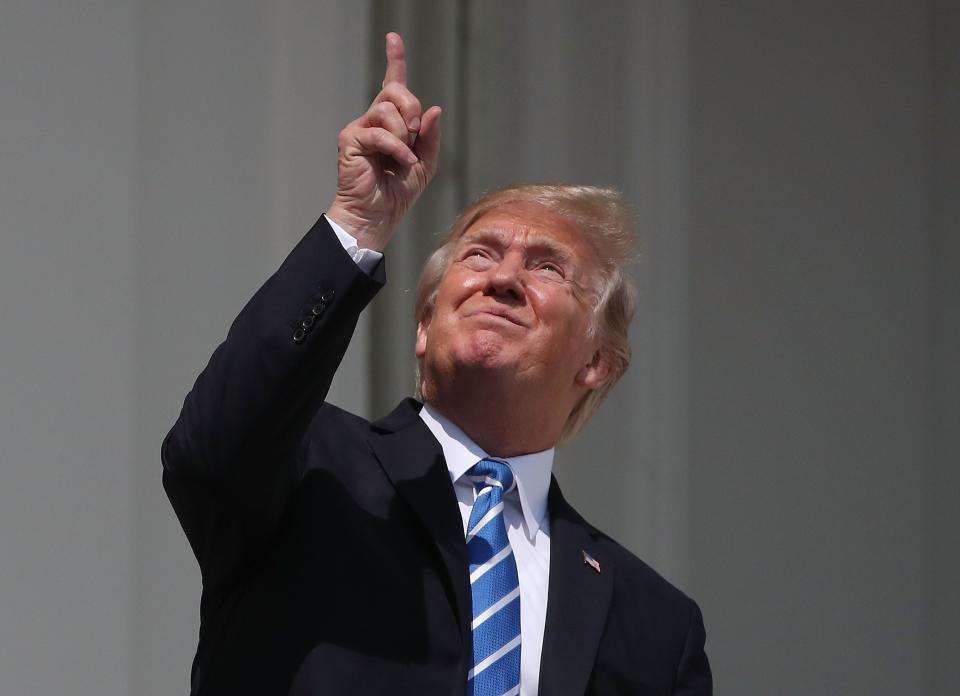 President Trump looks up toward the Solar Eclipse on the Truman Balcony at the White House on August 21, 2017 in Washington, D.C.