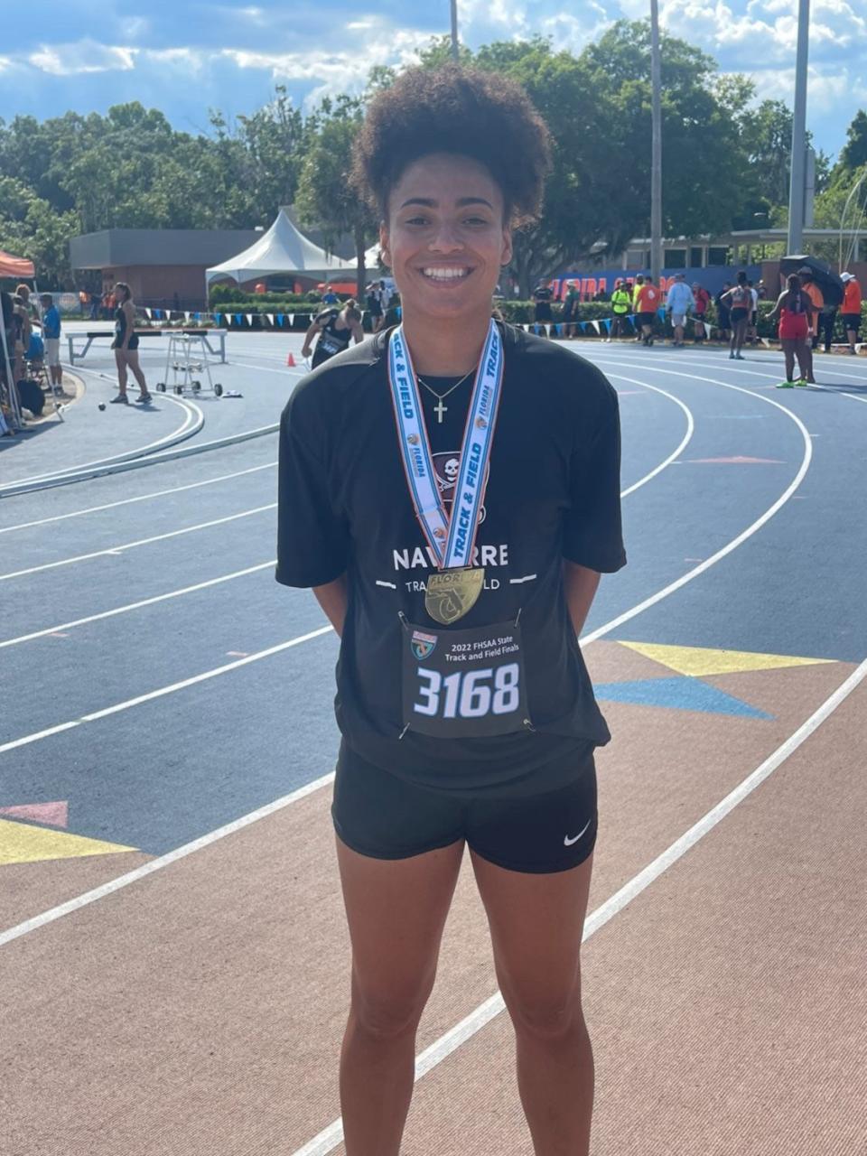 Navarre senior Rachel Leggett poses for a photo after winning the high jump title at the Class 4A state track and field championships on Saturday, May 14, 2022 from the Percy Beard Track on the University of Florida campus in Gainesville.