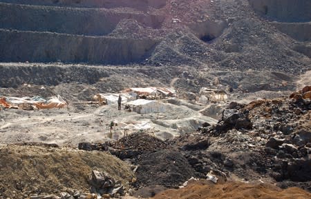 FILE PHOTO: Artisanal miners work at the Tilwezembe, a former industrial copper-cobalt mine, outside of Kolwezi, the capital city of Lualaba Province in the south of the Democratic Republic of the Congo