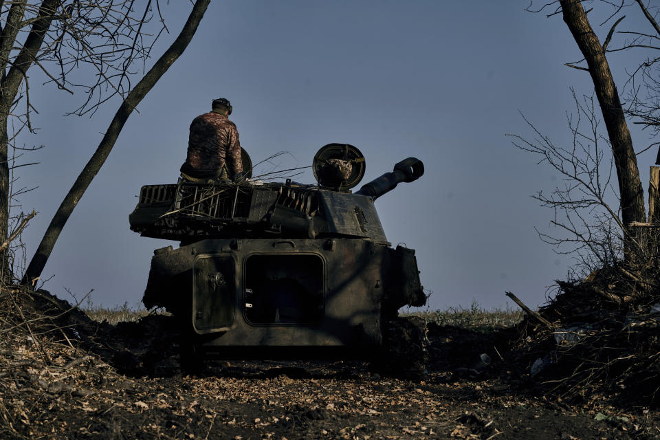 A self-propelled artillery vehicle prepares to fires near Bakhmut, Donetsk region, Ukraine, Wednesday, Nov. 9, 2022. (AP Photo/LIBKOS)