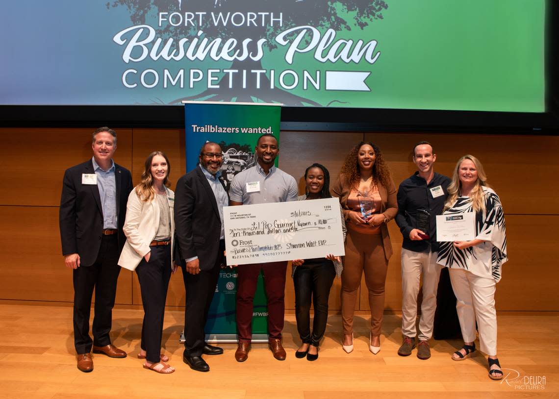 From left to right: Shannon Watt, Lauren Kutschke, and Robert Sturns with the winners of the 2023 Fort Worth Business Plan Competition, Michael and Shalonda Burnside, Saria Hawkins, Brian Frank and Michelle Holloway.