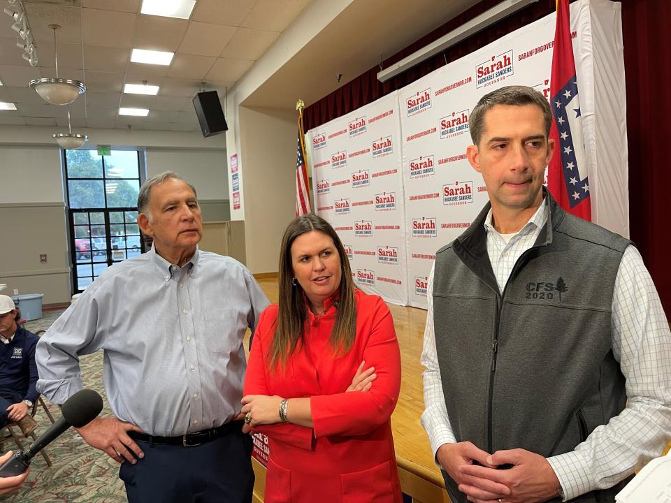 Sen. John Boozman, left, former White House press secretary Sarah Sanders, center, and Sen. Tom Cotton speak to reporters in Jacksonville, Ark., on Tuesday, Oct. 25, 2022. The three Republicans appeared at a campaign event for Sanders, who is running for Arkansas governor. (AP Photo/Andrew DeMillo)