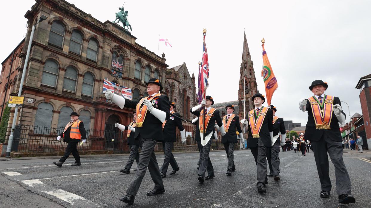 Members of the Orange Order take part in a Twelfth of July parade in Belfast, part of the traditional Twelfth commemorations