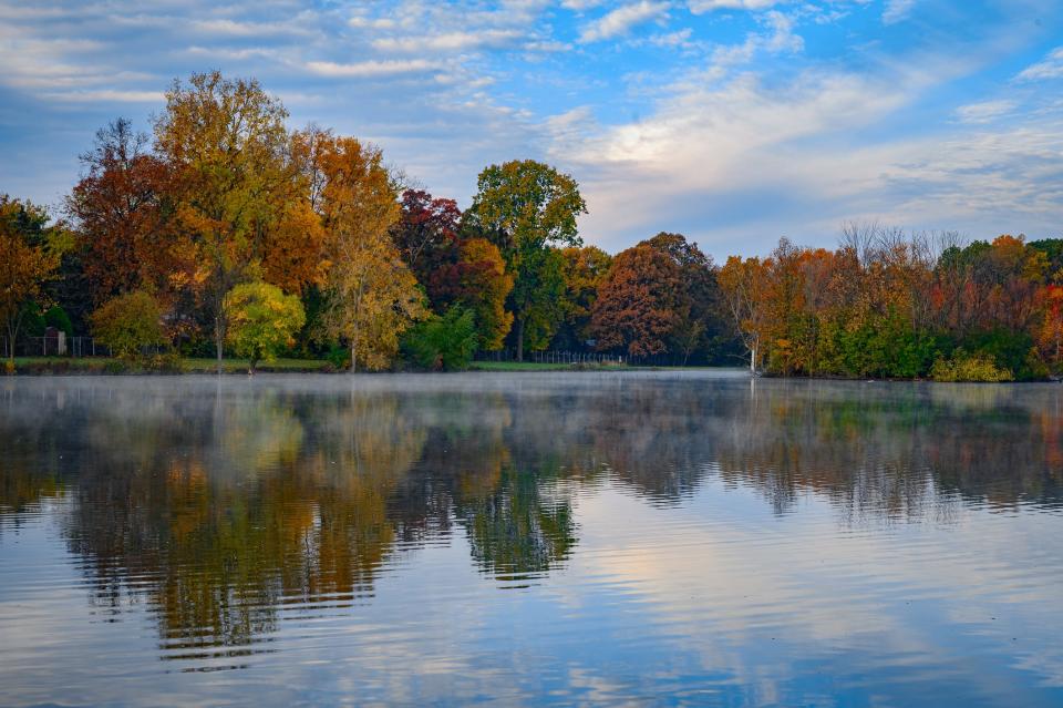Scenic view of lake by trees against sky during autumn,Troy,Michigan