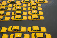 A parking lot full of yellow cabs is flooded as a result of superstorm Sandy on Tuesday, Oct. 30, 2012 in Hoboken, NJ. (AP Photo/Charles Sykes)