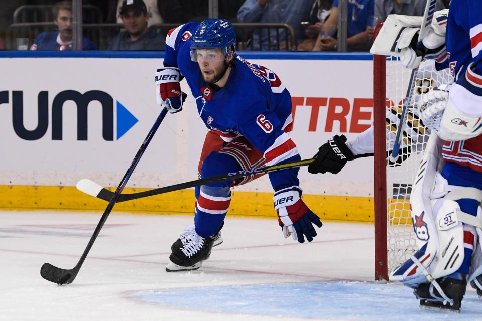 Oct 5, 2023; New York, New York, USA; New York Rangers defenseman Zac Jones (6) skates with the puck from behind the net against the Boston Bruins during the first second at Madison Square Garden.