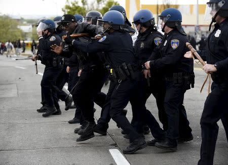 Police detain a protester during clashes near Mondawmin Mall after Freddie Gray's funeral in Baltimore April 27, 2015. REUTERS/Sait Serkan Gurbuz