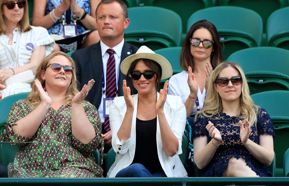 Duchess of Sussex watches Serena Williams on court one on day four of the Wimbledon Championships at the All England Lawn Tennis and Croquet Club, Wimbledon.
