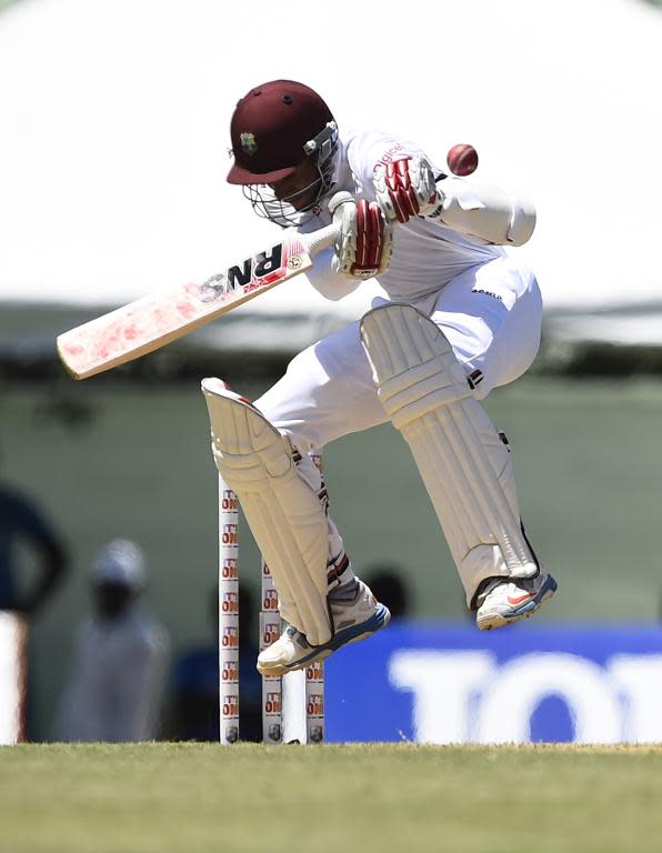 West Indies cricketer Shai Hope ducks to avoid being hit by a bouncer June 3, 2015 at Windsor Park Stadium in Roseau, Dominica